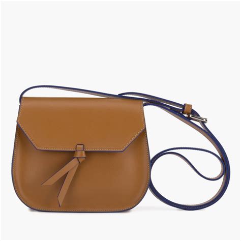 Mini Saddle Leather Crossbody Bag .